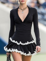 Casual Black V-neck Mini Dress With White Ruffled Trim On The Hem.