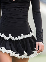 Casual Black V-neck Mini Dress With White Ruffled Trim On The Hem.