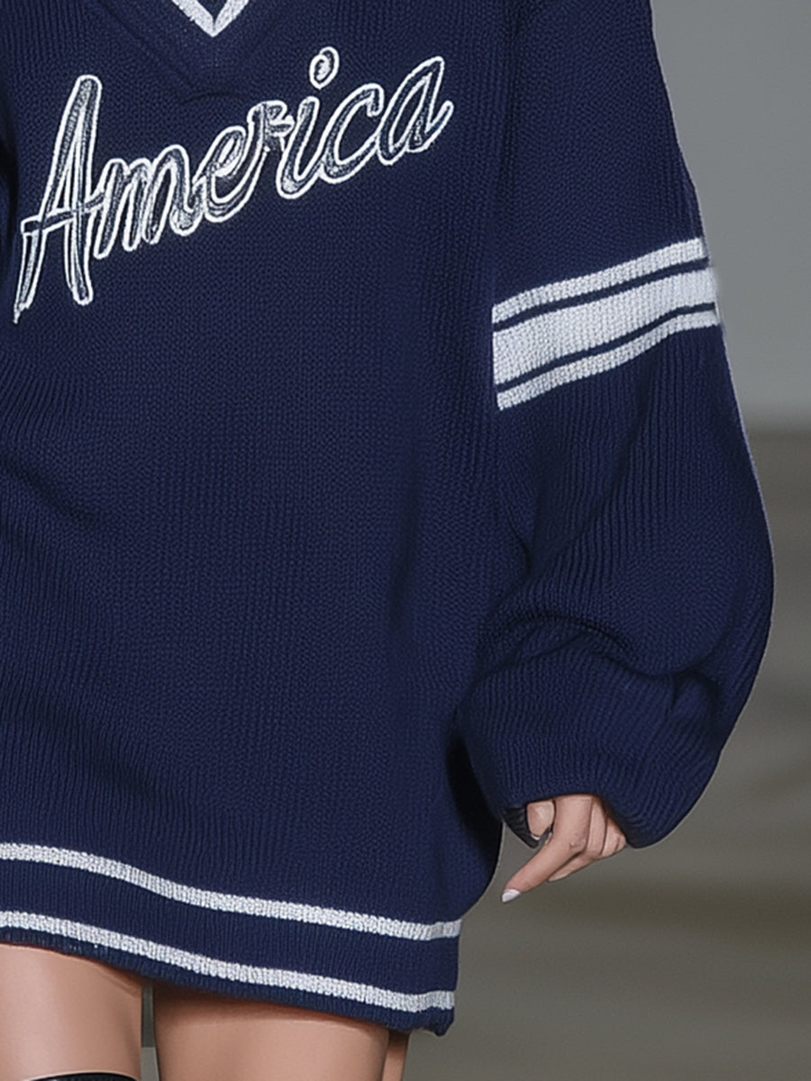 Stylish Blue Knitted Mini Dress With White Embroidery And Contrasting Panels.