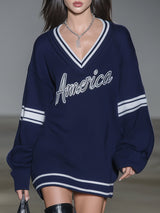 Stylish Blue Knitted Mini Dress With White Embroidery And Contrasting Panels.