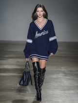 Stylish Blue Knitted Mini Dress With White Embroidery And Contrasting Panels.