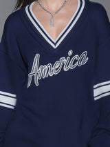 Stylish Blue Knitted Mini Dress With White Embroidery And Contrasting Panels.