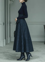 Dark blue turtleneck stretch top and plaid skirt set