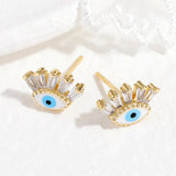 Boucles d'oreilles œil protecteur en cristal doré - Biloria
